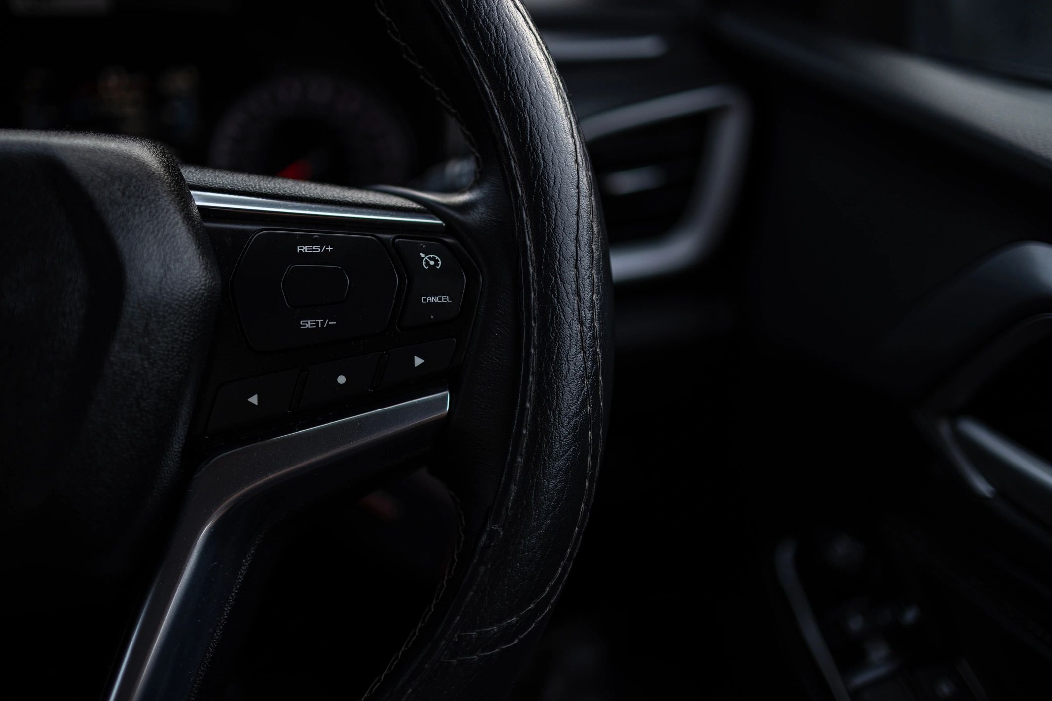 Close-up of a modern car steering wheel with integrated controls
